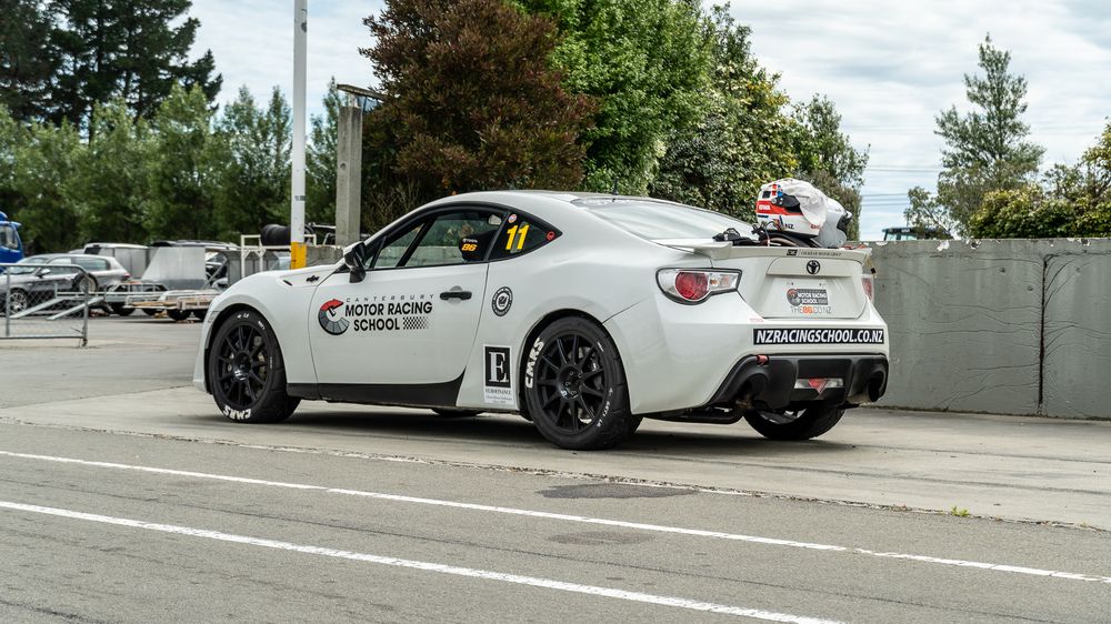 School Toyota 86 in pit lane with helmet on the wing